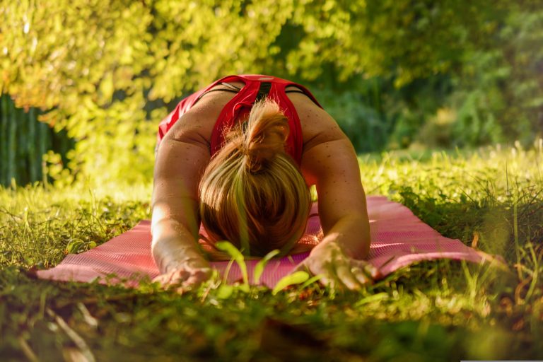 Young woman doing gentle stretching before exercise