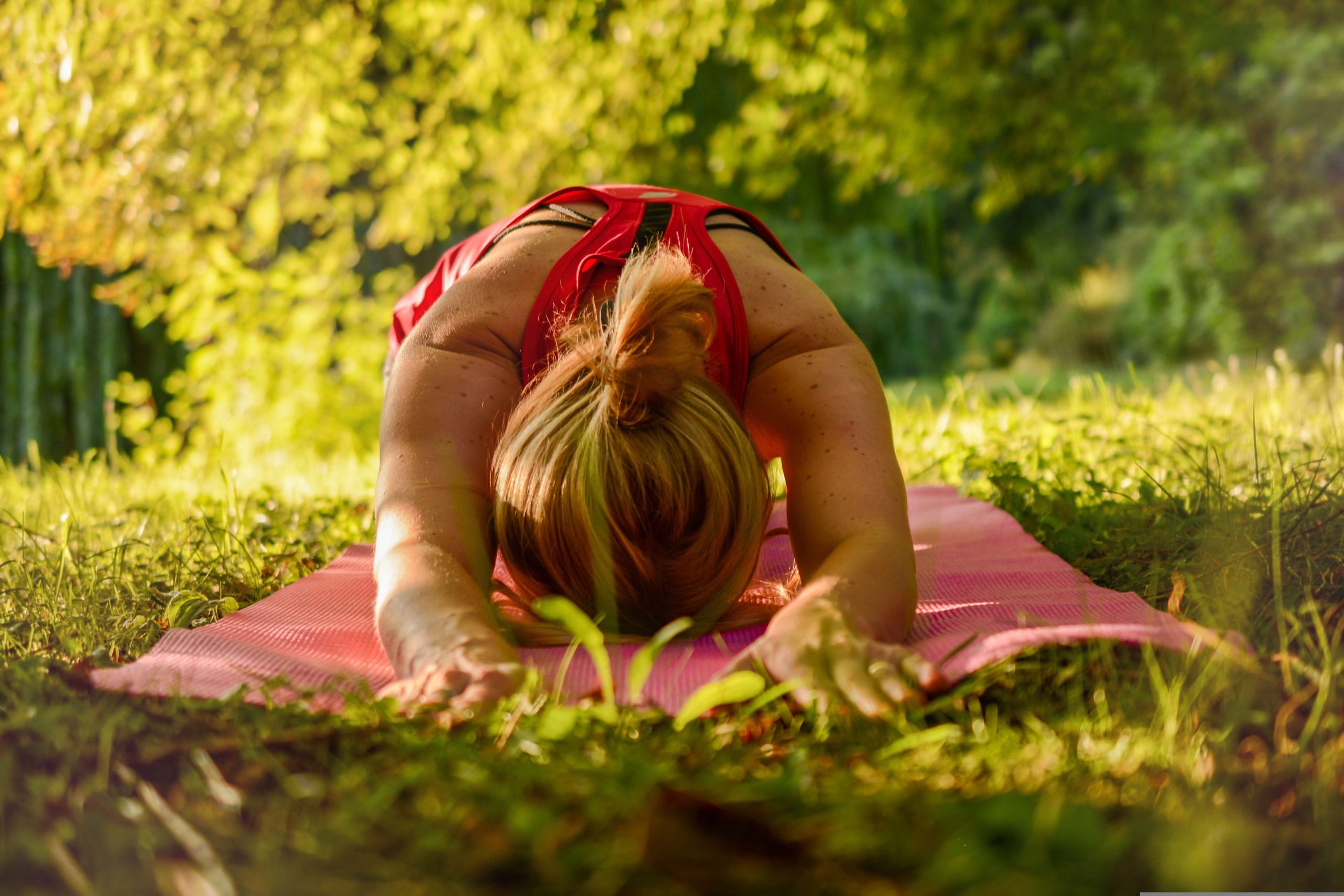 Young woman doing gentle stretching before exercise