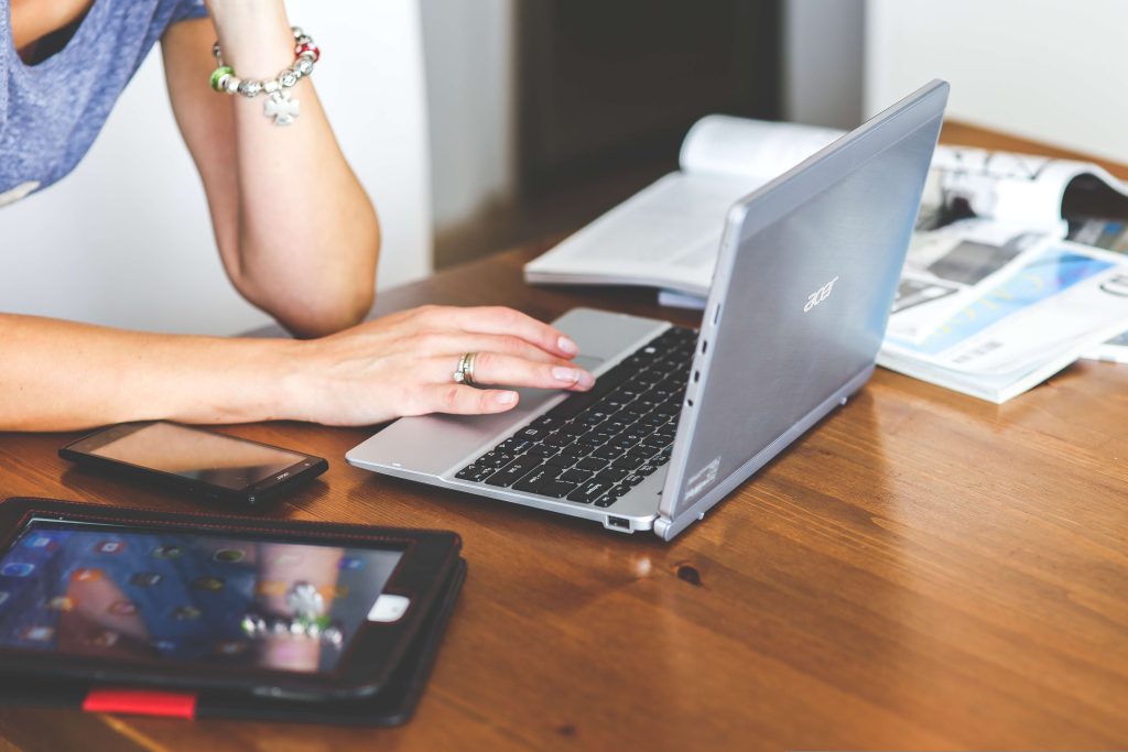Woman using a laptop at a desk in a comfortable working position